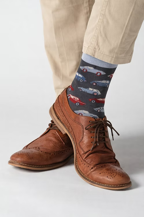 Bamboo socks featuring car designs on a light grey background