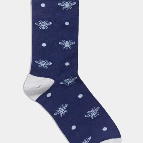 Navy sock with white bee pattern.