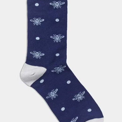 Navy sock with white bee pattern.