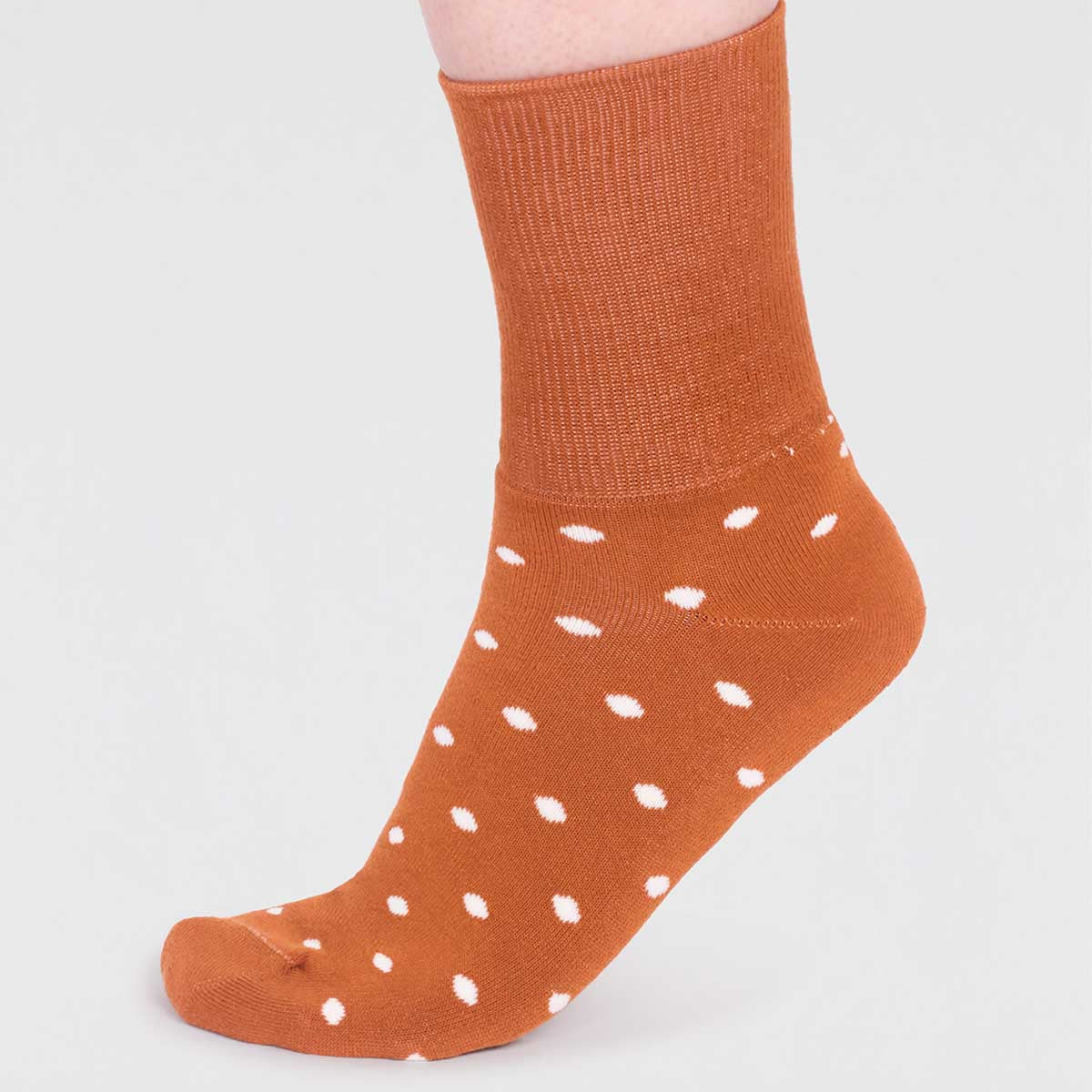 Orange thick organic cotton socks with white polka dots