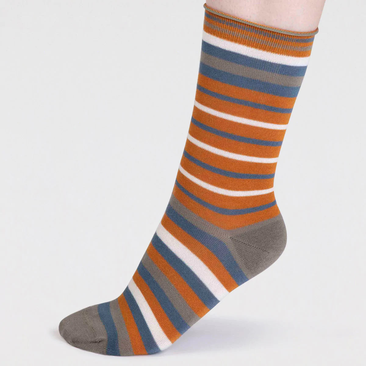 Side view of Orange, Grey, Blue and White striped organic cotton and bamboo sock by thought