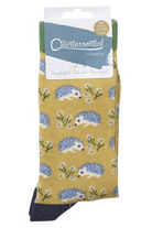 Packaged sock with hedgehog pattern on a mustard background