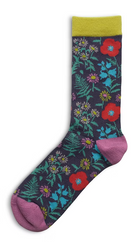 Colorful floral-patterned sock with a green cuff and pink toes