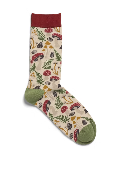 Sock with toadstool pattern on a white background