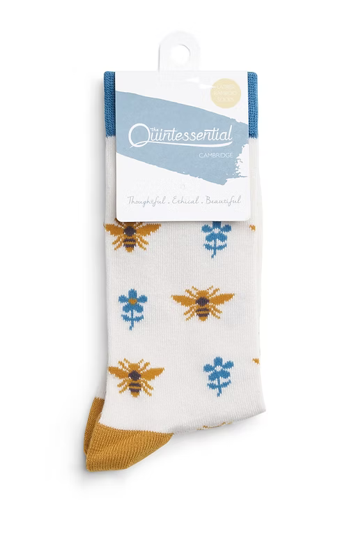 Packaged bamboo socks with bee and flower pattern.