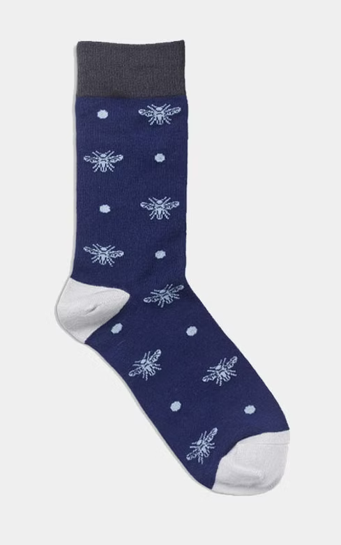 Navy sock with white bee pattern.