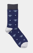 Navy sock with white bee pattern.