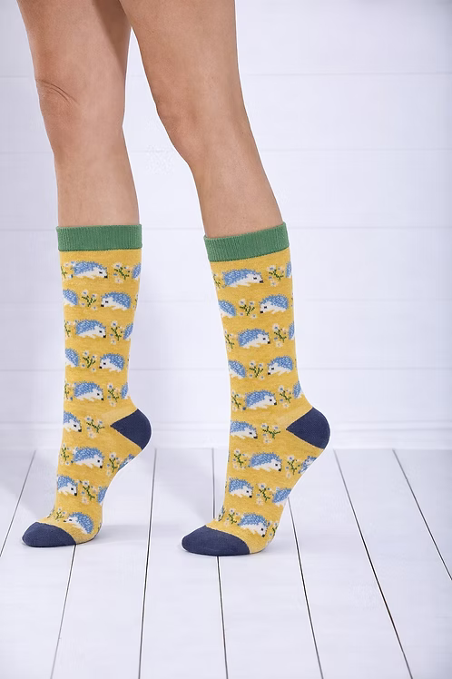 Yellow socks with hedgehog pattern