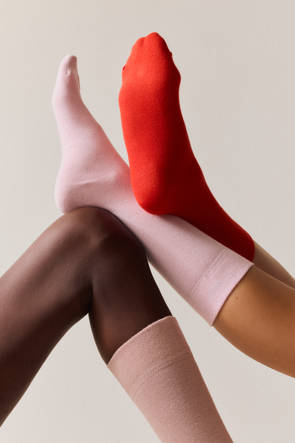 Pairs bamboo calf socks being worn, including Faded Pink