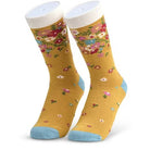 Pair of mustard yellow socks with floral pattern and blue toes