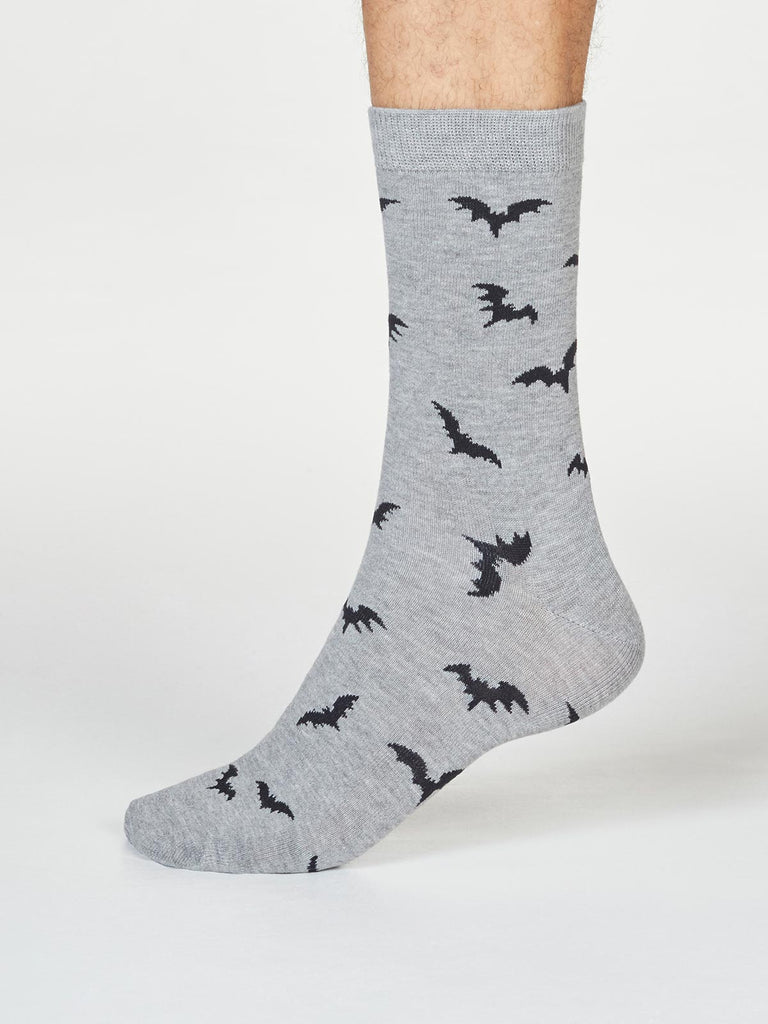 Side view of super soft premium bamboo socks featuring a spooky bat design with a grey background.