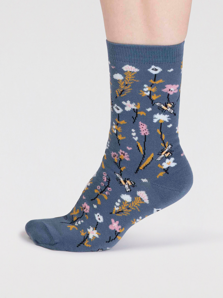 Misty Blue organic cotton sock with pink, yellow and white flowers with yellow leaves and bumble bees