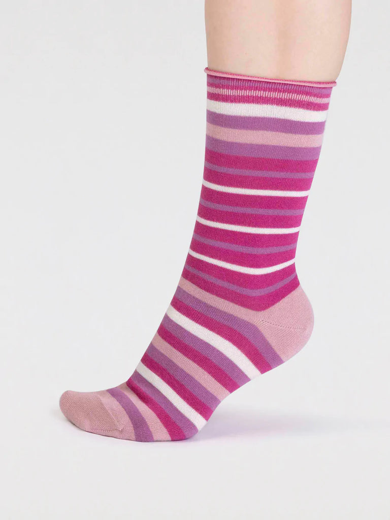 Side view of pink, purple and white striped organic cotton and bamboo sock by thought