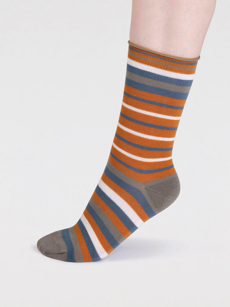Side view of Orange, Grey, Blue and White striped organic cotton and bamboo sock by thought