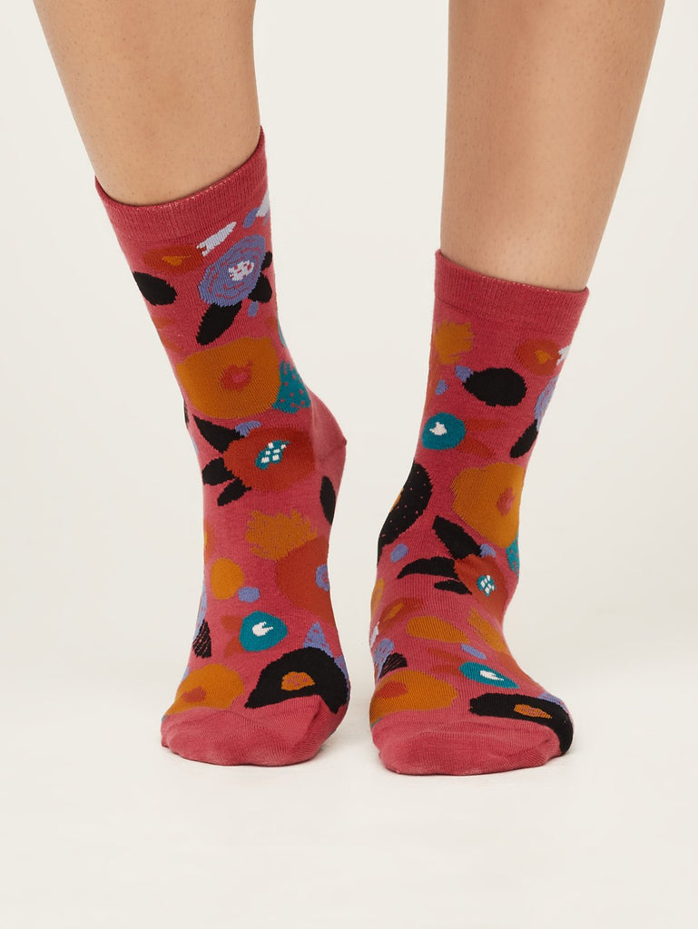 Front view of abstract floral super soft premium quality organic socks in blush pink with orange purple red and green flower design.